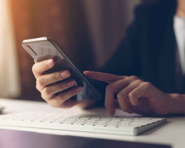 Woman using smartphone. The concept of using the phone is essential in everyday life.